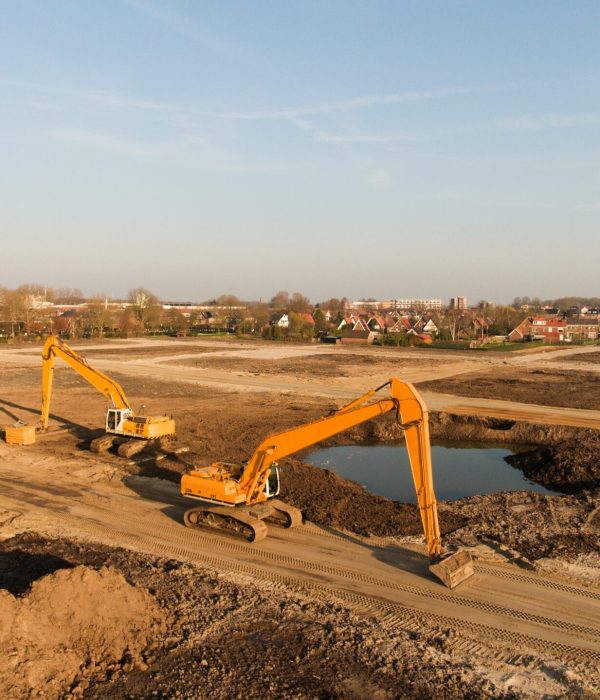 A high angle shot of two excavators on a building site